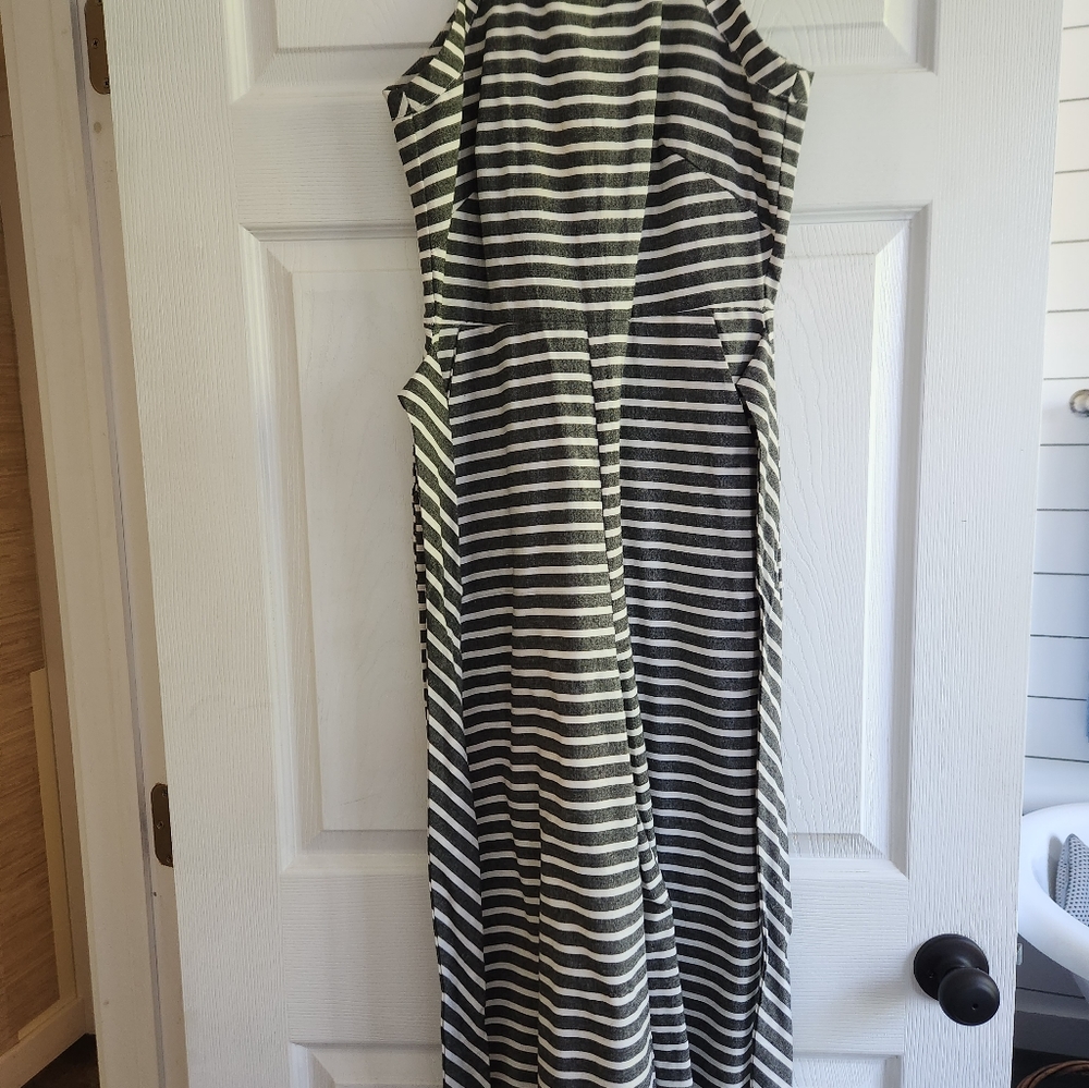 Cropped, sleeveless, high neck jumpsuit with pockets and a belt